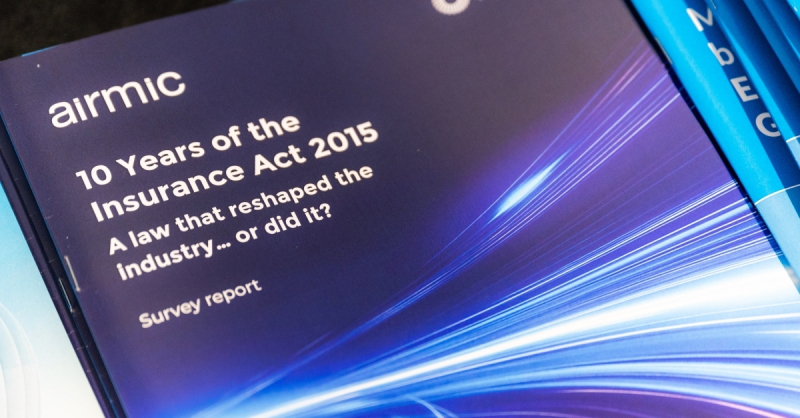 A photograph of a printed copy of the report.